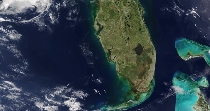 Very high-altitude overflight aerial of the Florida peninsula. Clip loops and is reversible. Elements of this image furnished by USGS/NASA Landsat