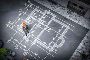 Man engineer thinking over his plan. Mixed media