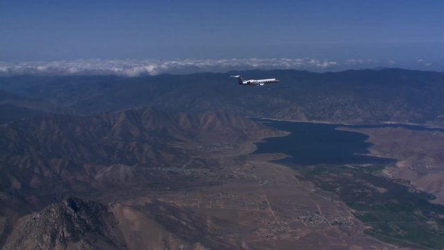 Air-to-air circling view of jet in flight