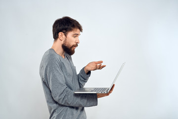 man in profile in hands laptop