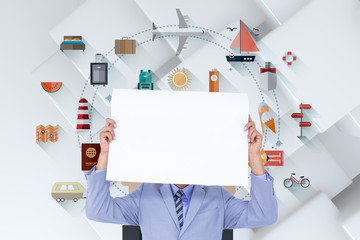  Portrait of a businessman hiding his face behind a blank panel against white tile design