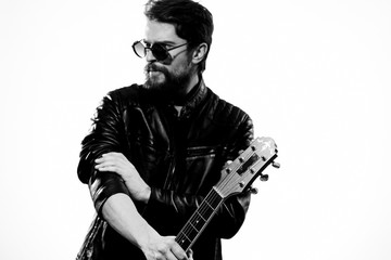 musician in glasses with a guitar
