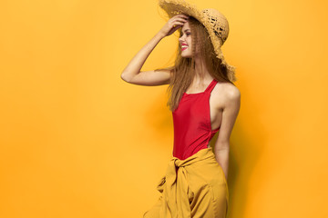 woman in a bathing suit on a yellow background