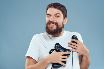 man with a joystick on a blue background