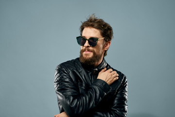 Naklejka premium stylish man with glasses on a blue background