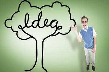 Geeky young hipster waving at camera against green vignette