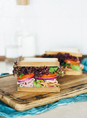 large sandwiches turkey meat served chopping board