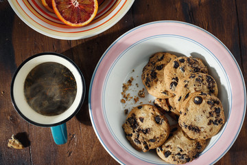 Homemade chocolate cookies cup hot tea wooden table top view
