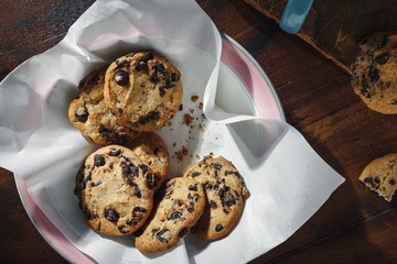 Homemade chocolate cookies bowl wooden table top view