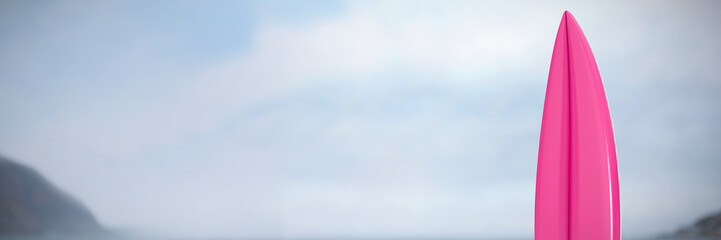 Close-up of surfboard against sea against cloudy sky