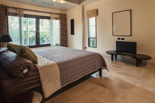 Modern bed room interior in Luxury villa. Big window, light space, marble floor