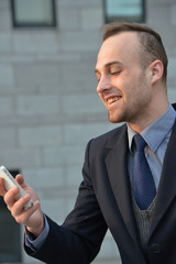 handsome businessman using smartphone