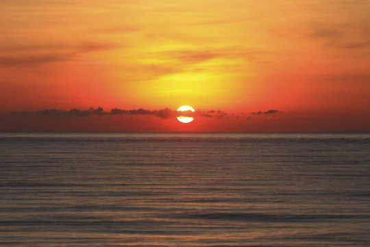 An image of a nice red sunset with a big yellow sunset