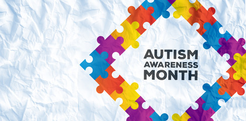 Autism awareness month against crumpled white page