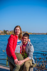 Fototapeta premium Plus size couple lovers walking in a park. Young man and woman overweight couple at vacation 