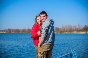 Fototapeta premium Plus size couple lovers walking in a park. Young man and woman overweight couple at vacation 