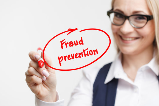 Technology, internet, business and marketing. Young business woman writing word: fraud prevention