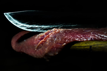 knife cuts meat grim still-life