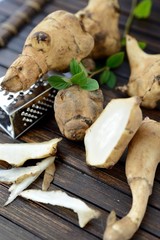 Jerusalem artichoke on a wooden table 