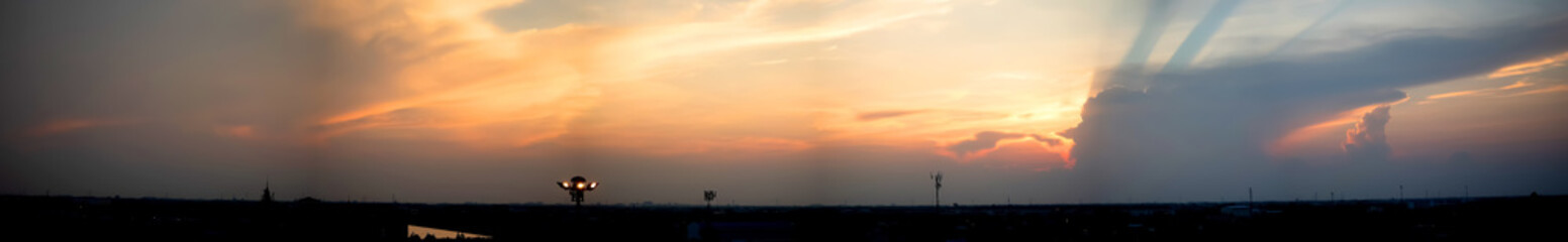 Dramatic atmosphere panorama view of beautiful twilight summer sky and clouds in suburb area.