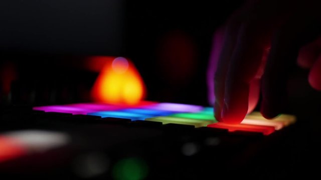 Creating music in studio environment from a digital audio workstation beatmaker with color drum pads