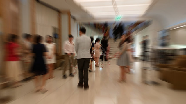 Wedding in the hotel. And the bride out to greet the bridegroom. There are many guests in attendance. Abstract photo blur