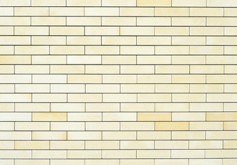 Fine texture of the wall light yellow bricks. Background.