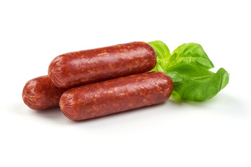 Salami smoked sausages with herbs isolated on white background