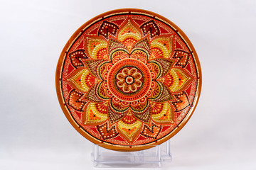 Decorative ceramic dish painted with hands. Art, handmade.