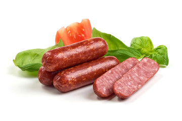 Salami smoked sausages with herbs and tomatoes isolated on white background