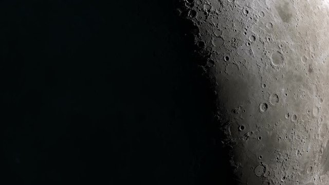 Camera flies around a craters in the Moon finishing in full moon image. Elements of this image furnished by NASA's Scientific Visualization Studio.