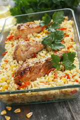 Chicken legs baked with rice and vegetables