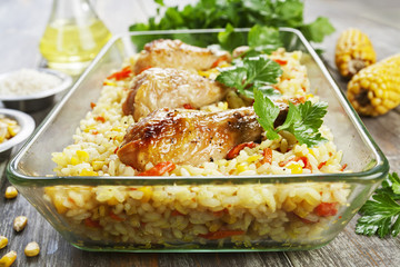 Chicken legs baked with rice and vegetables