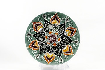 Decorative ceramic dish painted with hands. Art, handmade.