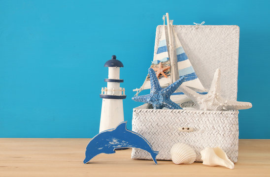 nautical, vacation and travel image with sea life style objects over wooden table.