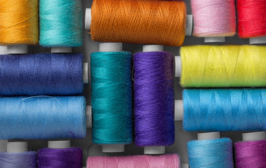 colored thread on bobbins red yellow green blue
