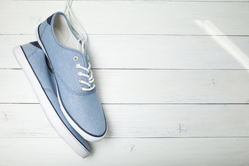 Blue casual urban sneakers on white background.