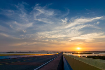 Fototapeta premium Sunset sky with road