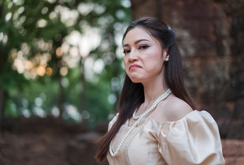 Fototapeta premium Depressed woman in Thai dress