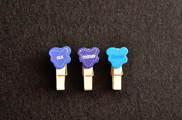 Six minus three on a black background