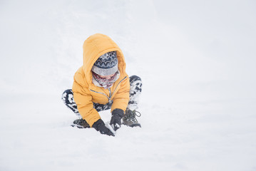 child playing in snow