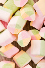 Marshmallows on wooden table. 