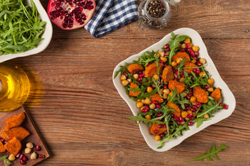 Sweet potato salad with lentils, pomegranates and rocket.
