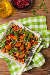 Sweet potato salad with lentils, pomegranates and rocket.