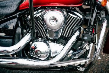 Fototapeta premium Closeup of motorbike with lots of chrome details. Modern powerful perfomance road motorcycle shiny reflexive surface engine with exhaust pipes. Vehicle industry. Two-wheeled vehicle technologies.