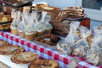 Vendors stand at food at small market