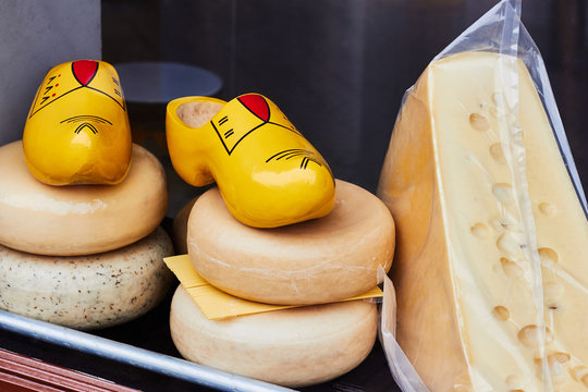 Dutch cheese and traditional wooden shoes clogs in the shop window