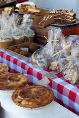 Vendors stand at food at small market