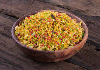 Indian Namkeen Food Navratan Mixture or Navratna Mix Namkeen Also Know As Nimco, Namkin, Mixture or Nimko on Wooden Background