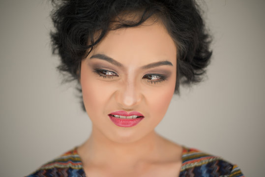 Young woman envy on  white background
